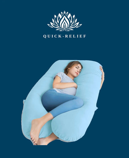 A pregnant woman lying comfortably on a blue Quick-Relief pregnancy pillow.